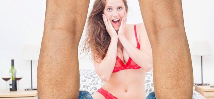 woman surprised by the increase in the size of man's penis photo 2