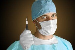 Surgeon performing penis enlargement operation for medical reasons